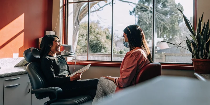 Calm San Diego patient discussing sedation dentistry for dental anxiety