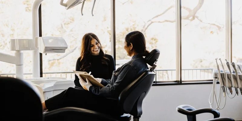 Dentist discussing dental implant cost options with a San Diego patient