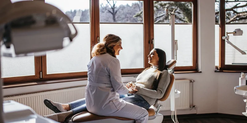 Dentist discussing comfortable sedation options with a relaxed patient